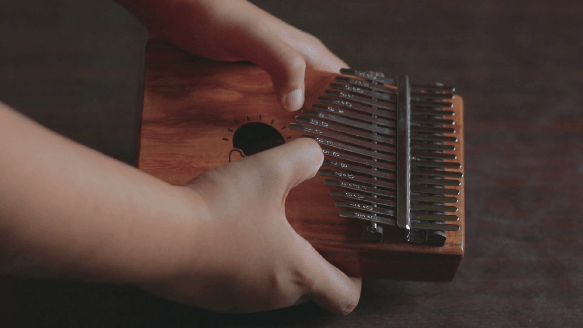 Playing chords on Kalimba. It is an African musical instrument