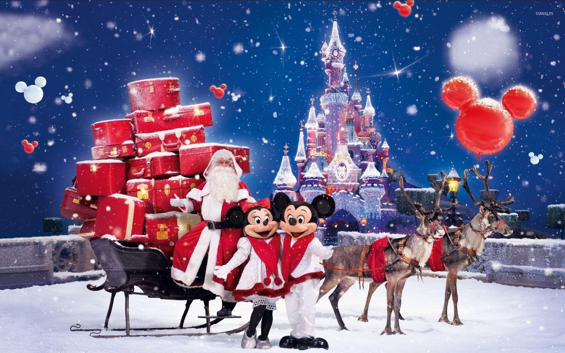 Santa Claus bringing gifts in a Disneyland park wallpaper