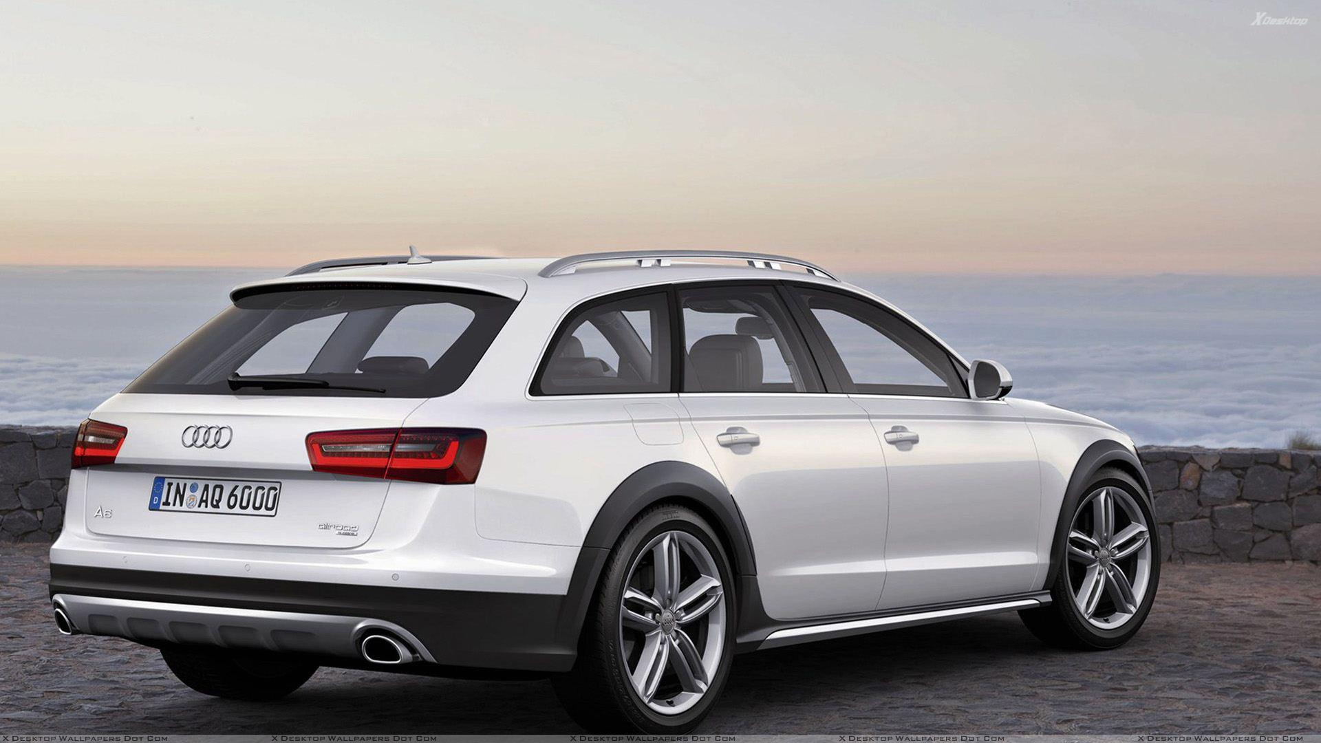 Back Side Pose Of 2013 Audi A6 Allroad In White Near Sea Side Wallpaper
