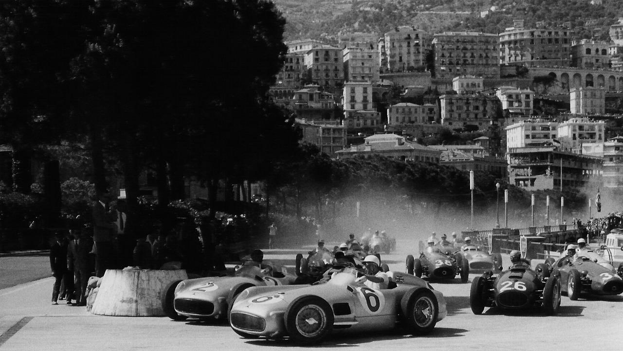 autocar: Stirling Moss and Fangio in the 1955 Monaco Grand Prix