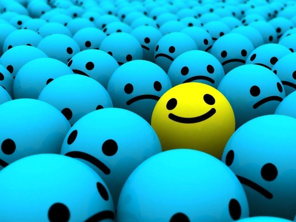 yellow smiley in group of blue smiley