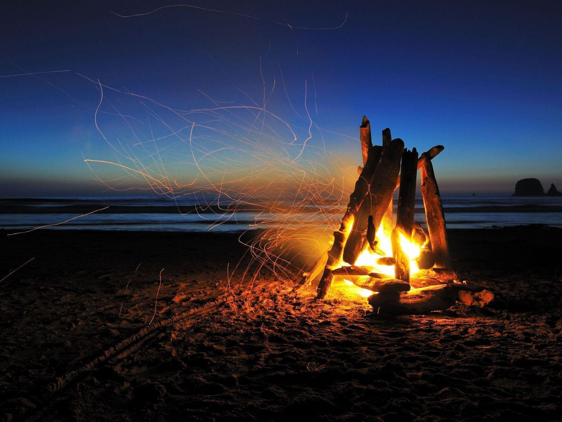 Beach campfire night Wallpaper