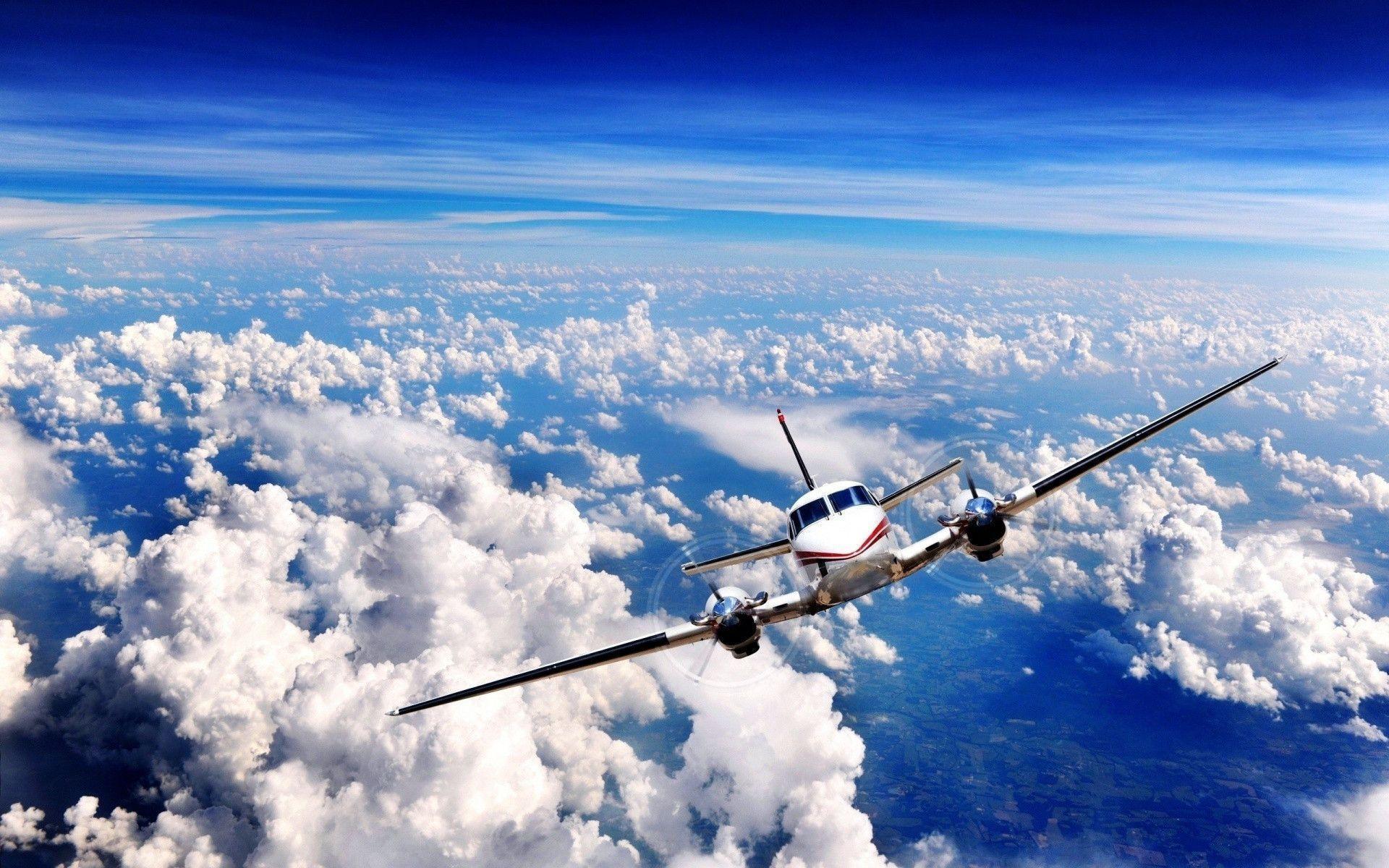 Airplane in Clouds Wallpaper