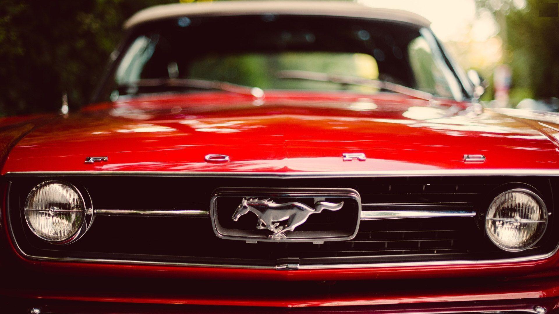 Elegant Red Classic Ford Mustang With Logo Wal. Wallpaper. Basic