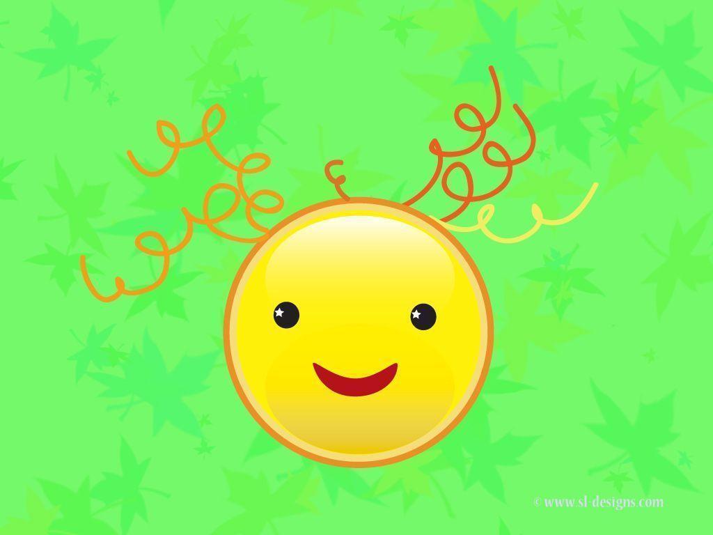 Smiley face on green desktop wallpaper