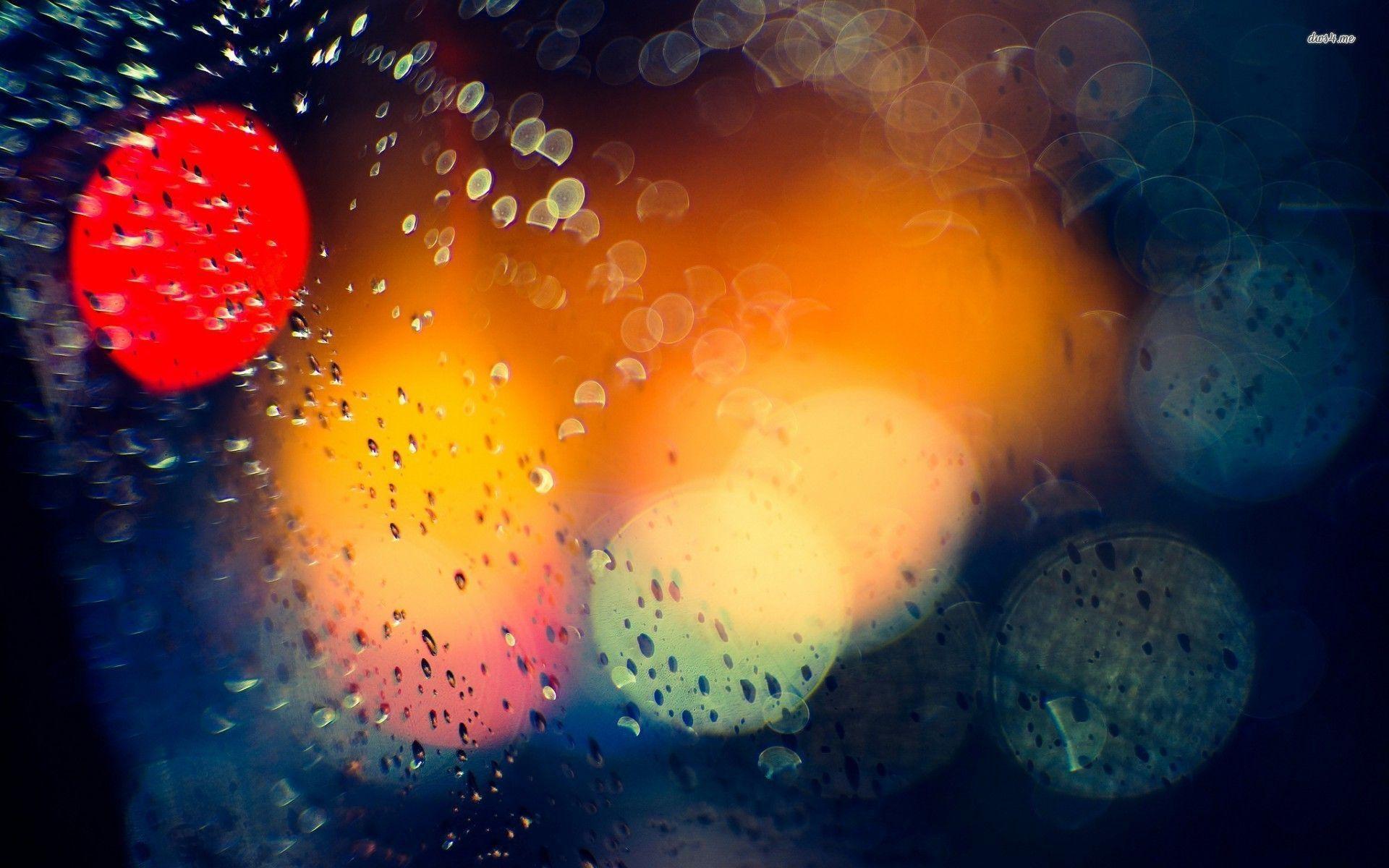 Colorful lights behind the rainy window wallpaper
