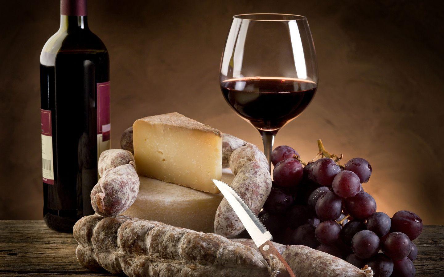 Red wine, grapes, chesse and sausages