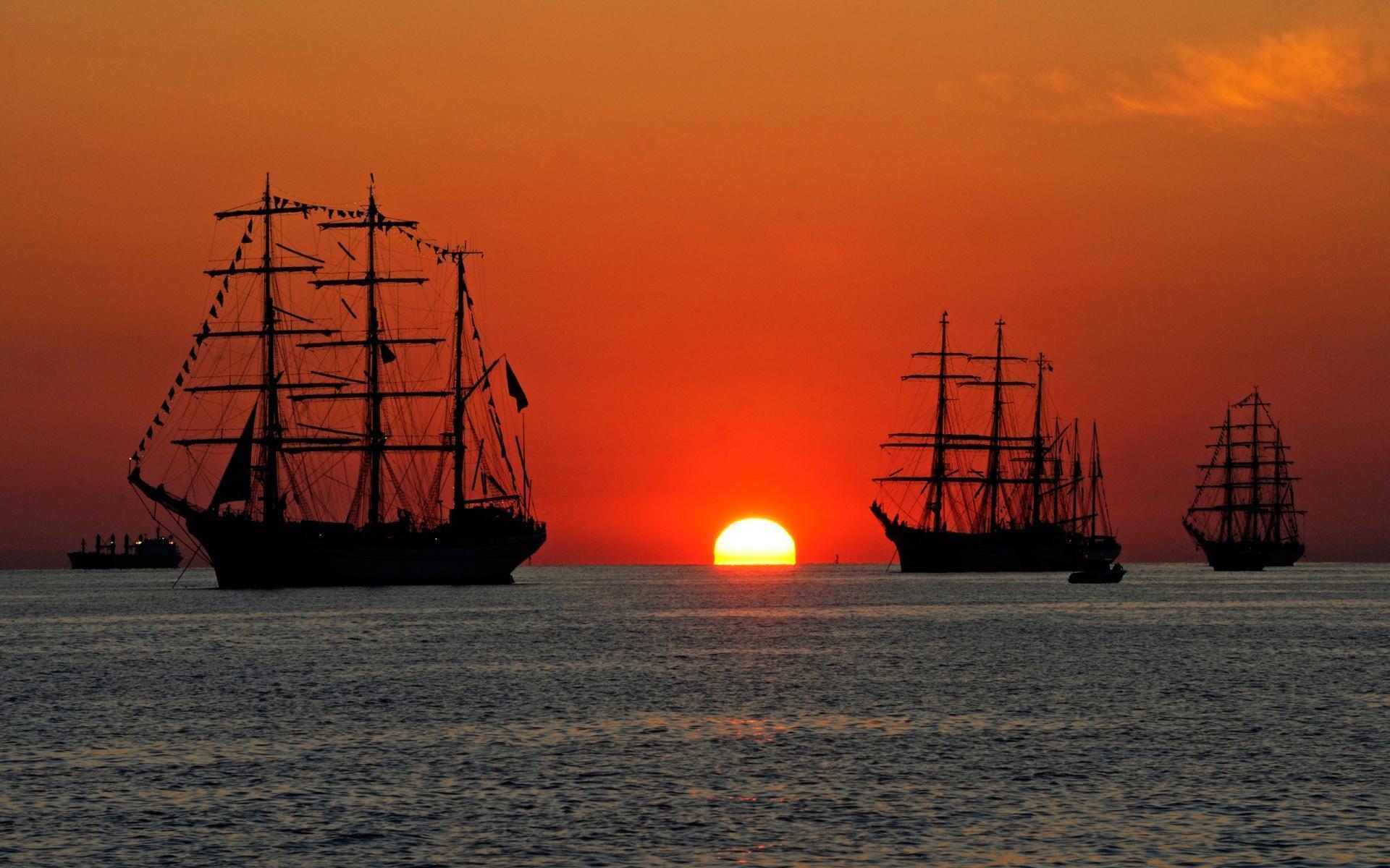 HD Tall Ships At Sea In Sunset Wallpaper