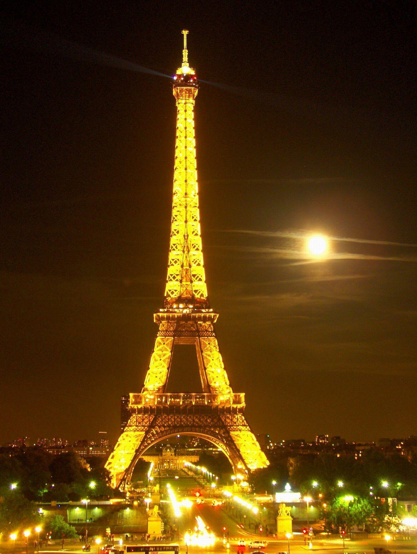 The Eiffel Tower in a moonlit night, France Travel photo