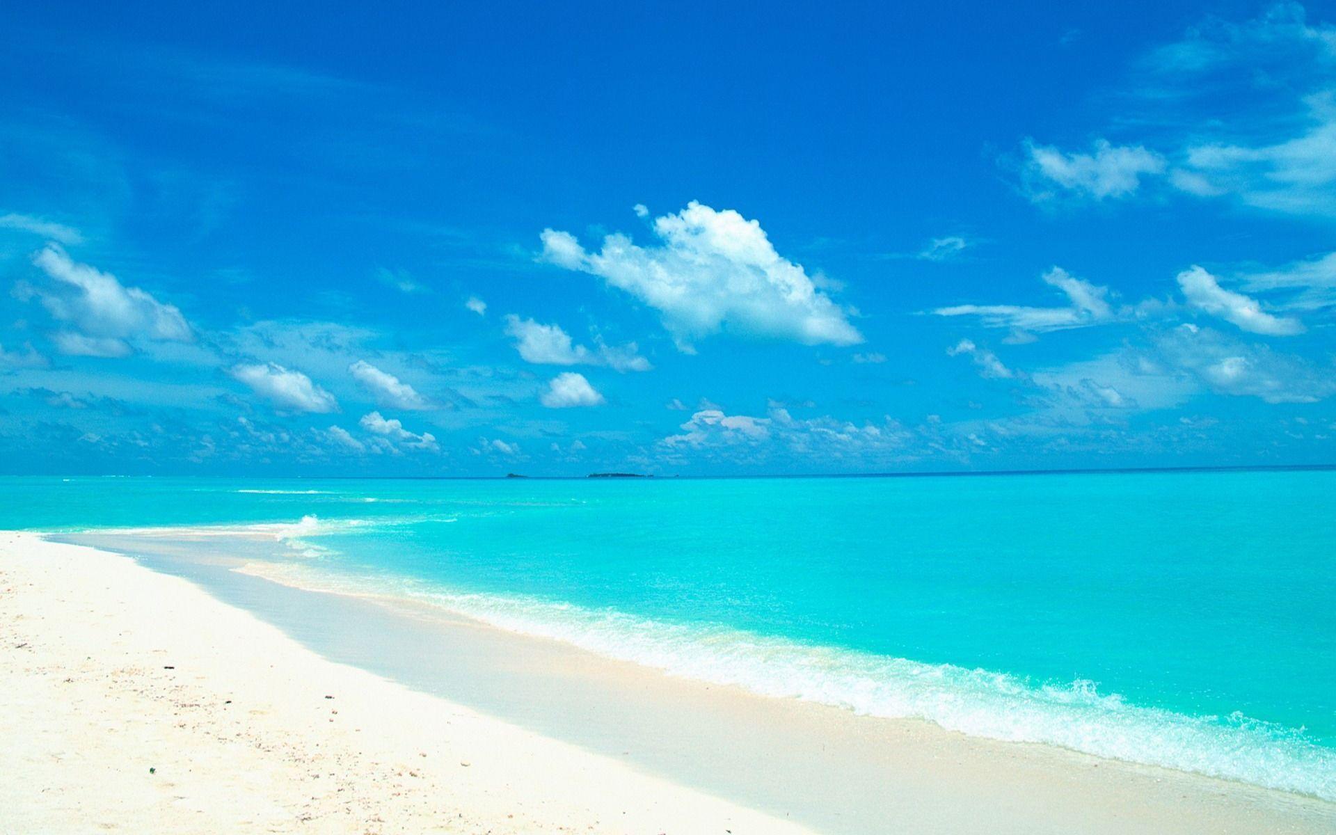 blue sky and water in the white sand beach wallpaper