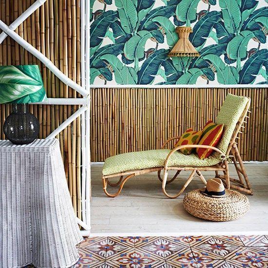 Living room with bamboo walls and tropical print wallpaper