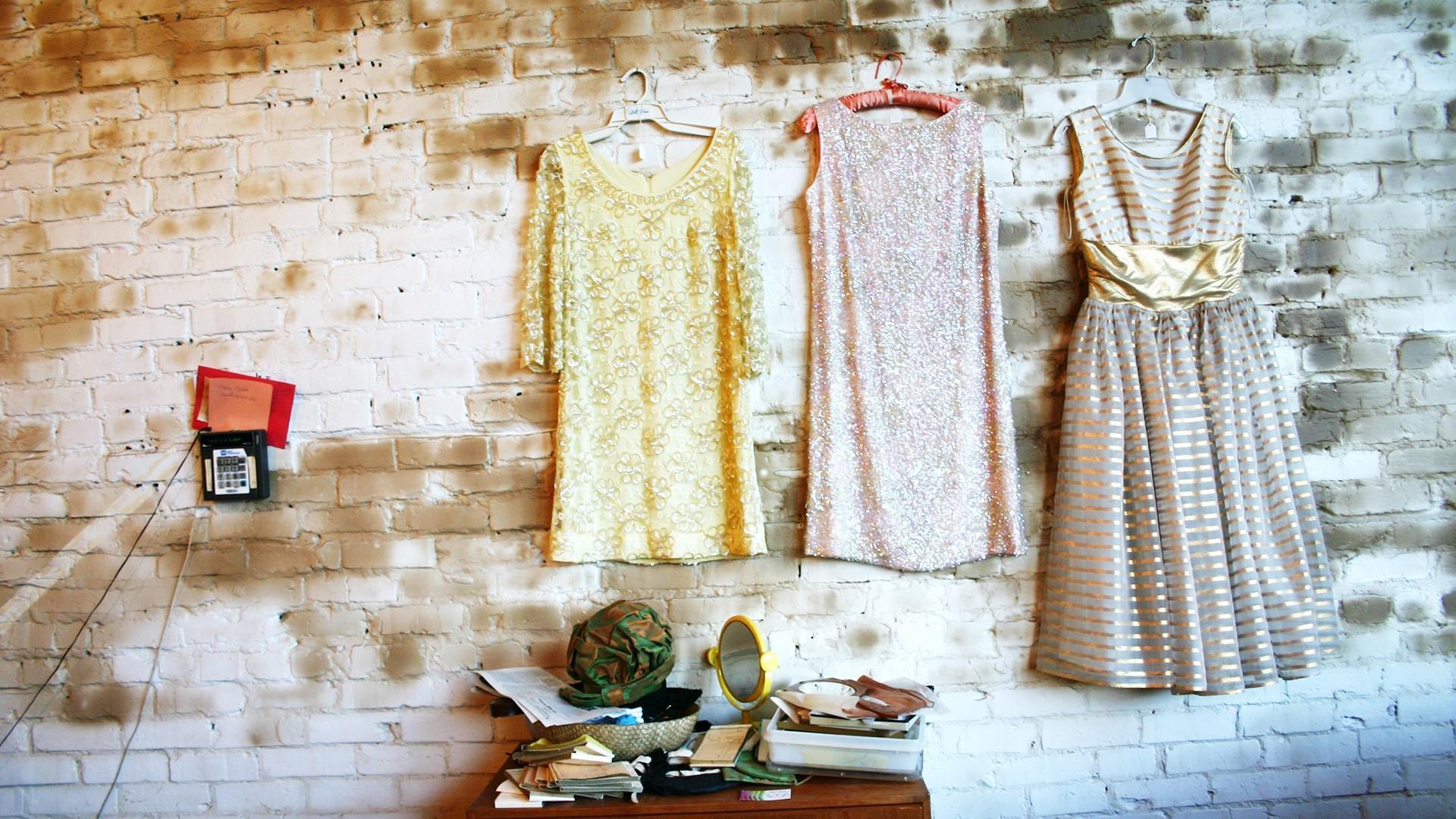 Brick wall clothes dress hanging wallpaper