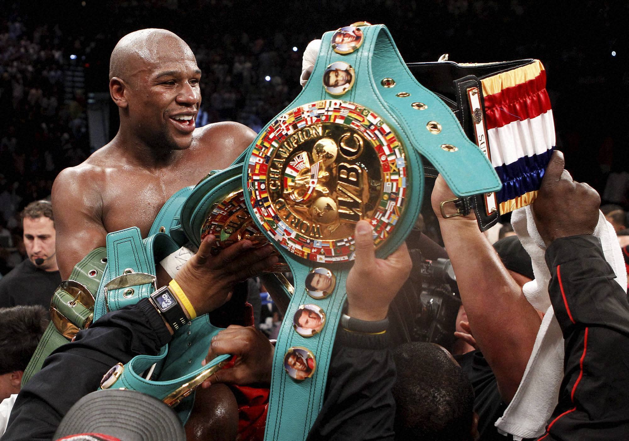 Boxer Floyd Mayweather Jr and his prizes wallpaper and image
