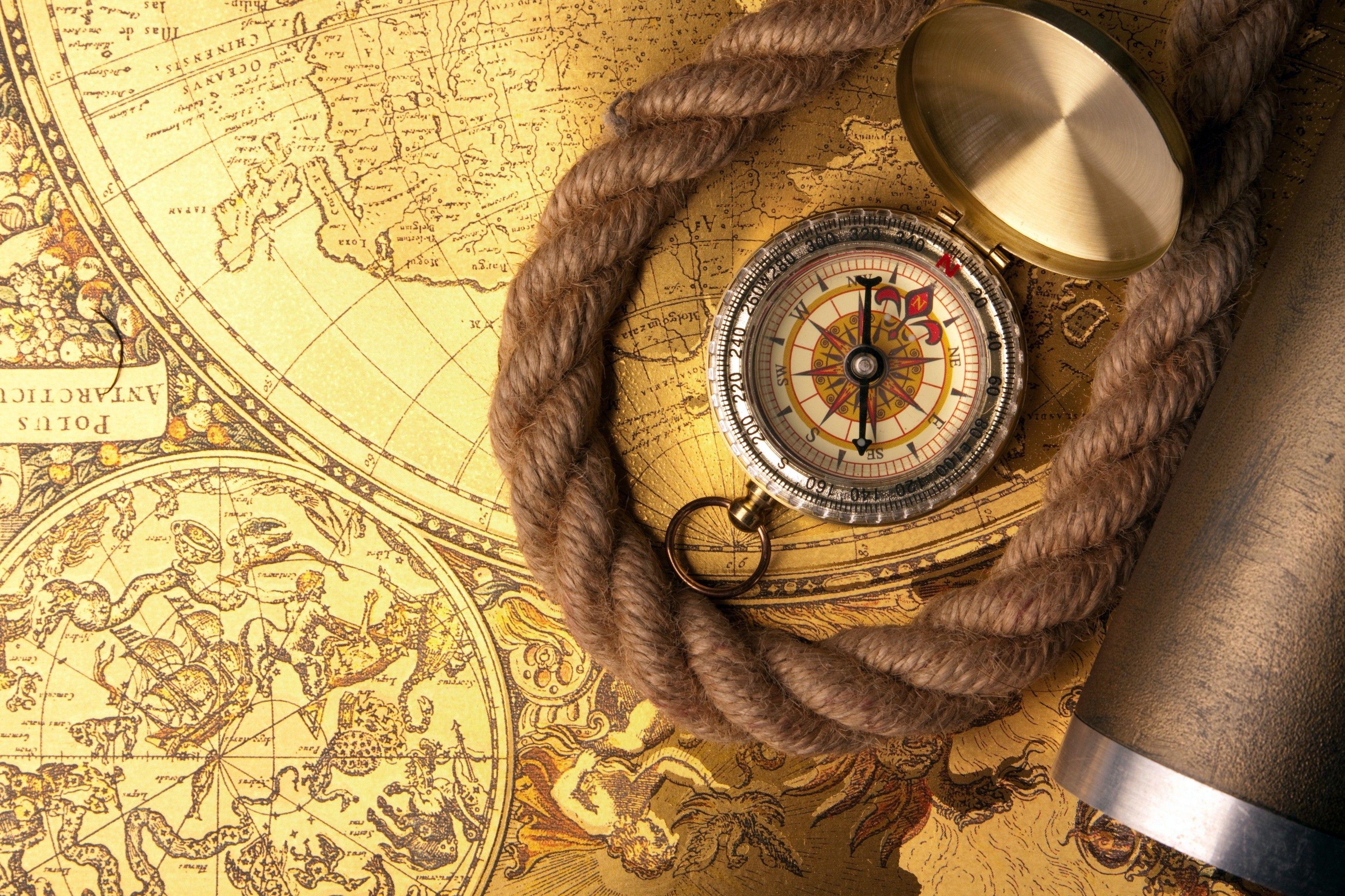 Compass with World Map. Macro Photo and Wallpaper