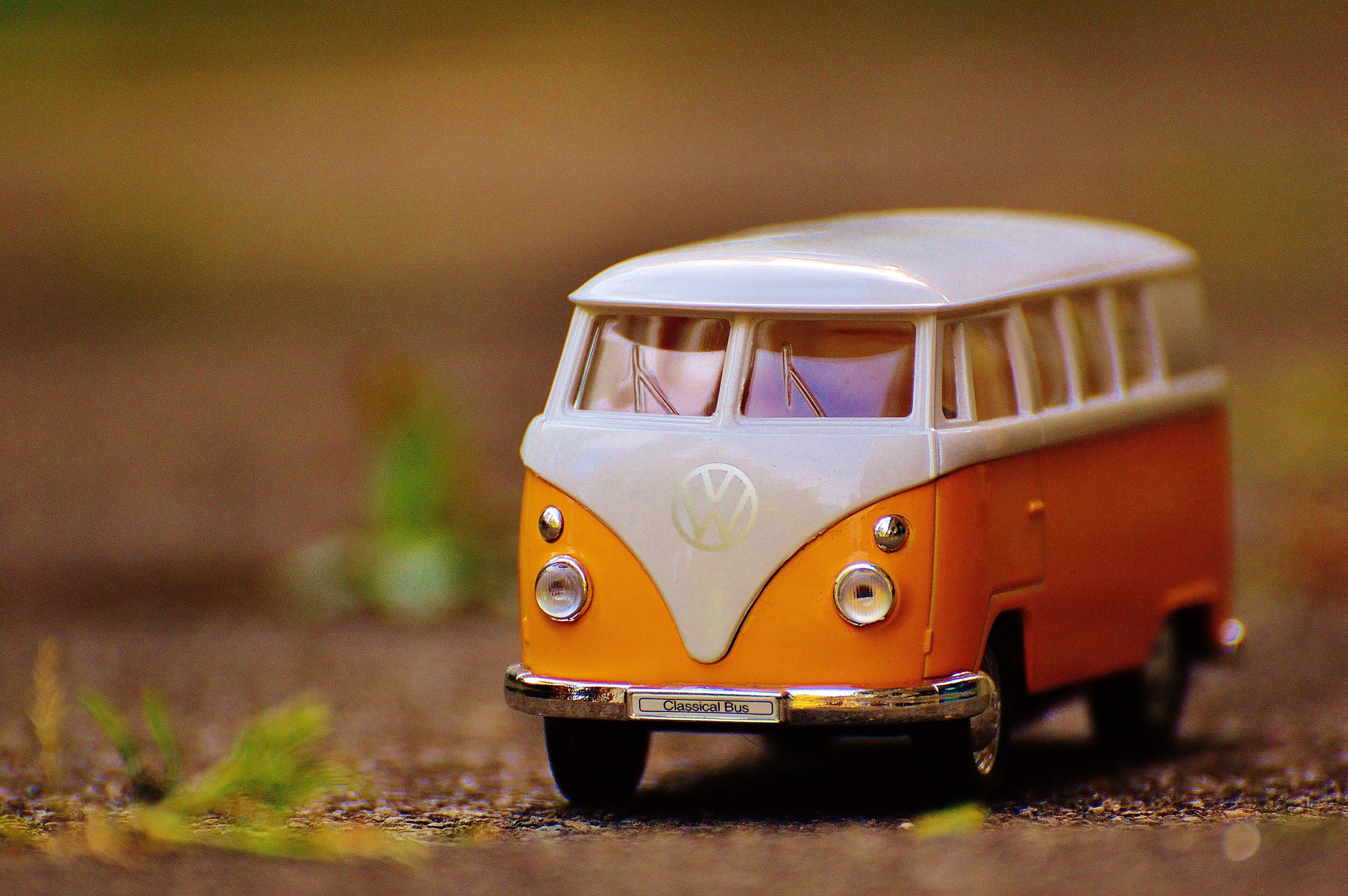 Orange and white Volkswagen bus toy HD wallpaper