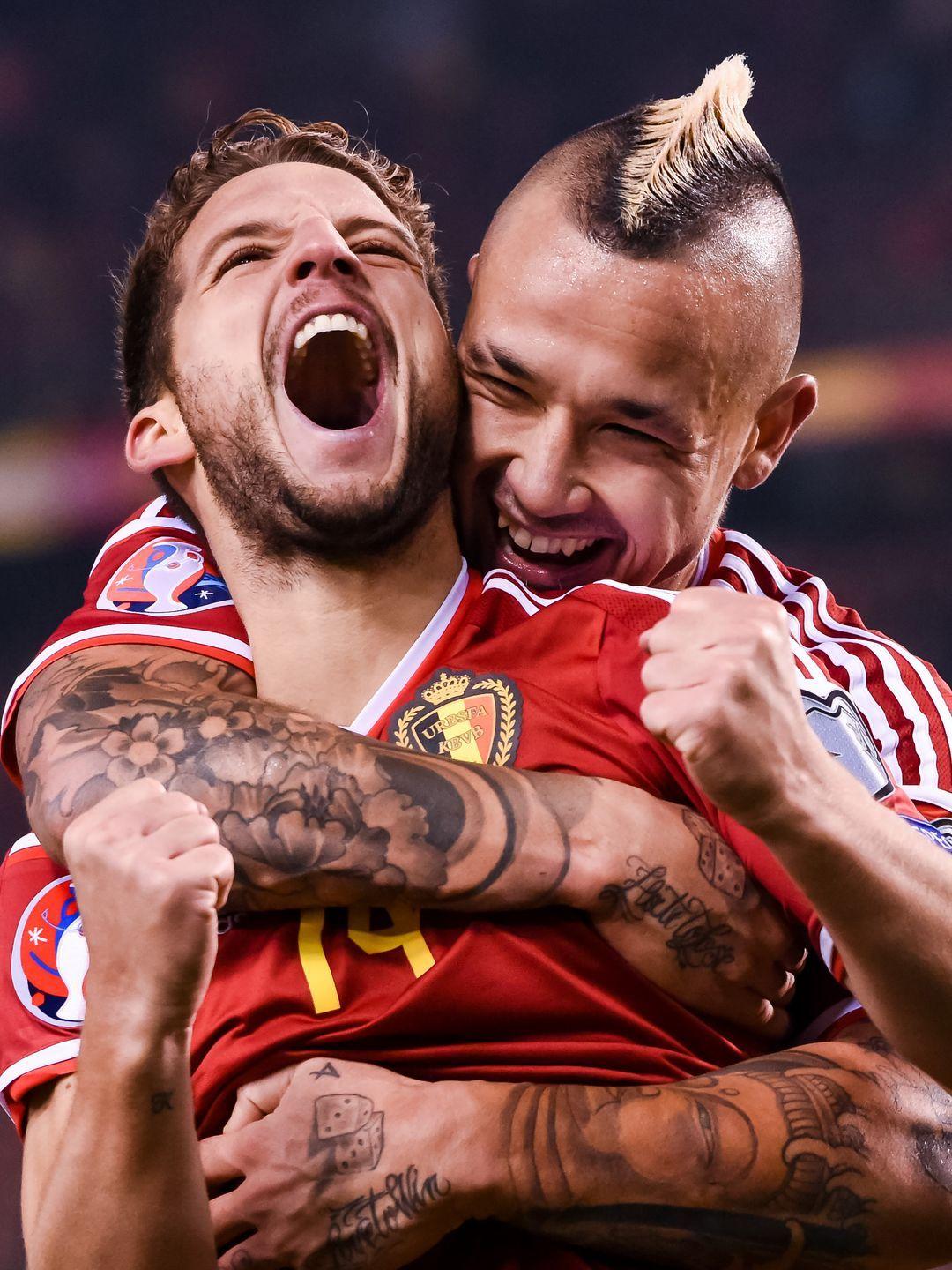 Belgium's Dries Mertens, left, celebrates with teammate Radja