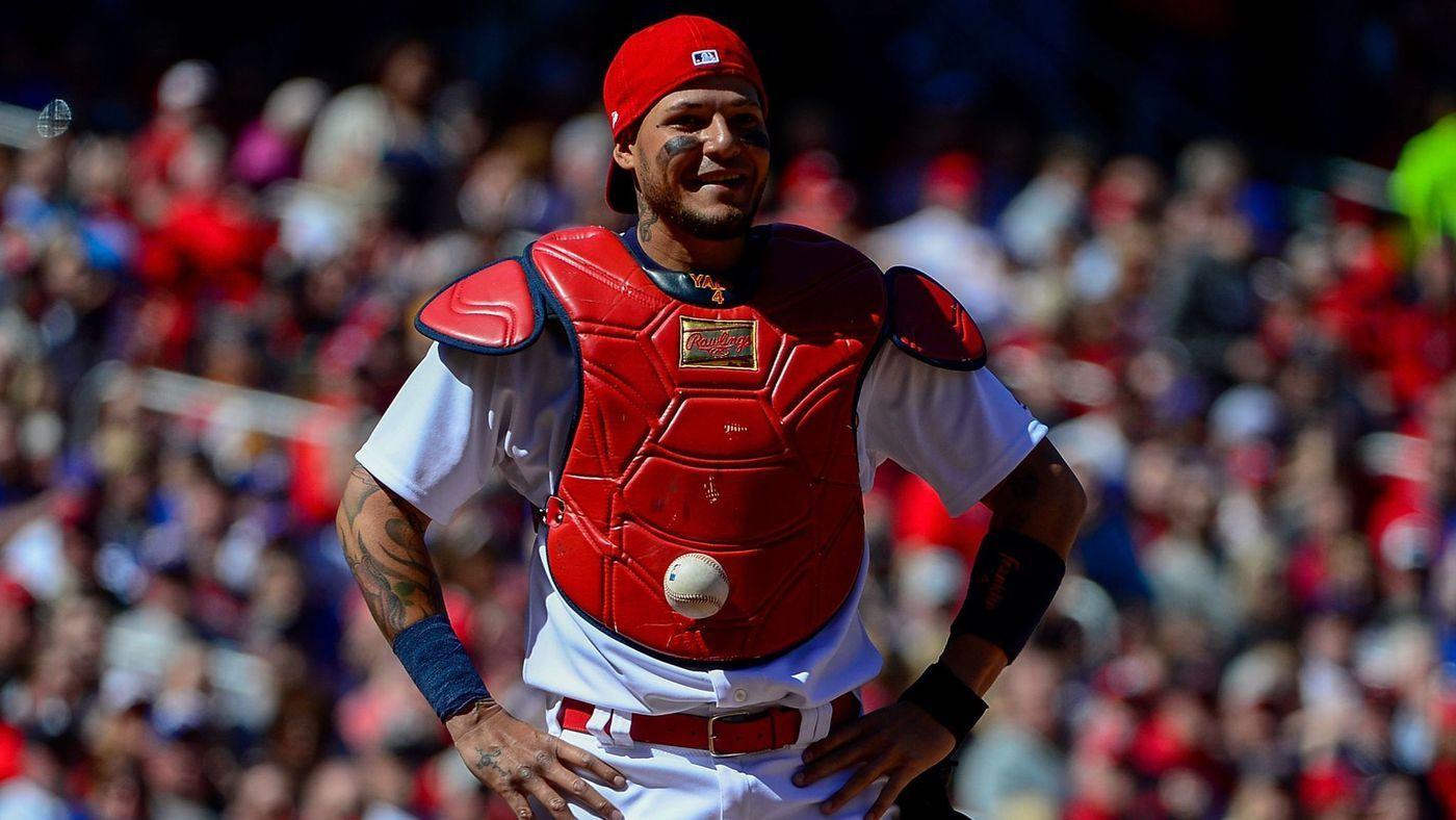 catcher Yadier Molina can't find the ball because it's stuck to