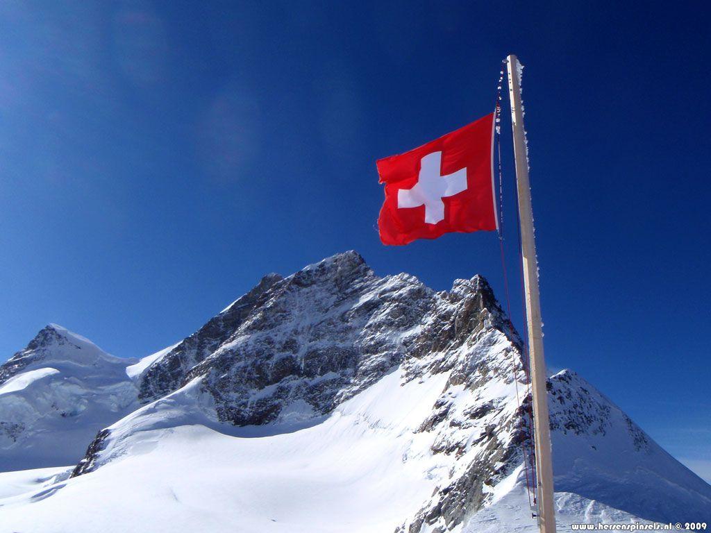 Wallpaper: 'Jungfrau and flag' Swiss flag is flying proudly