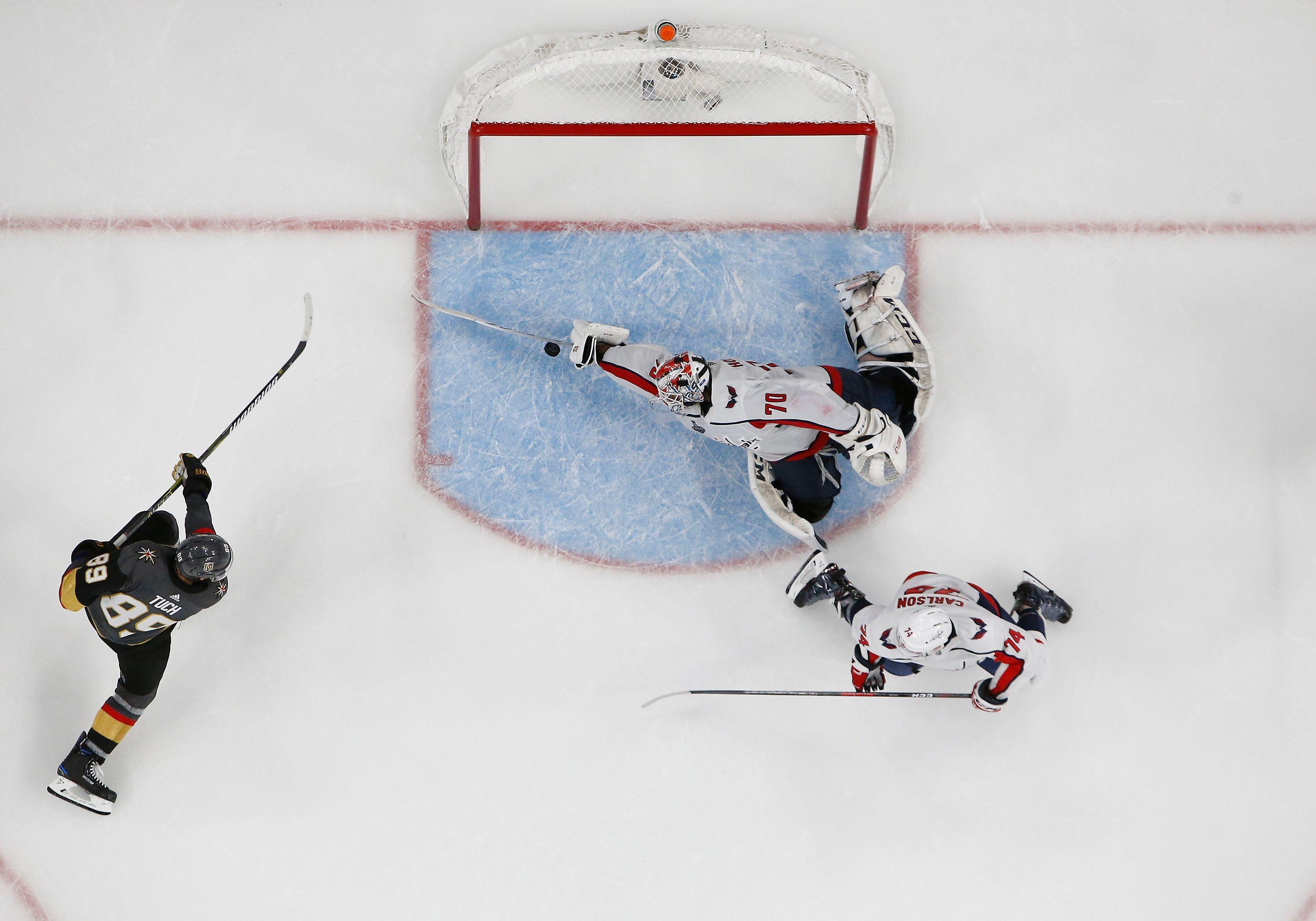 An NHL photographer captured an incredible image of Holtby's save