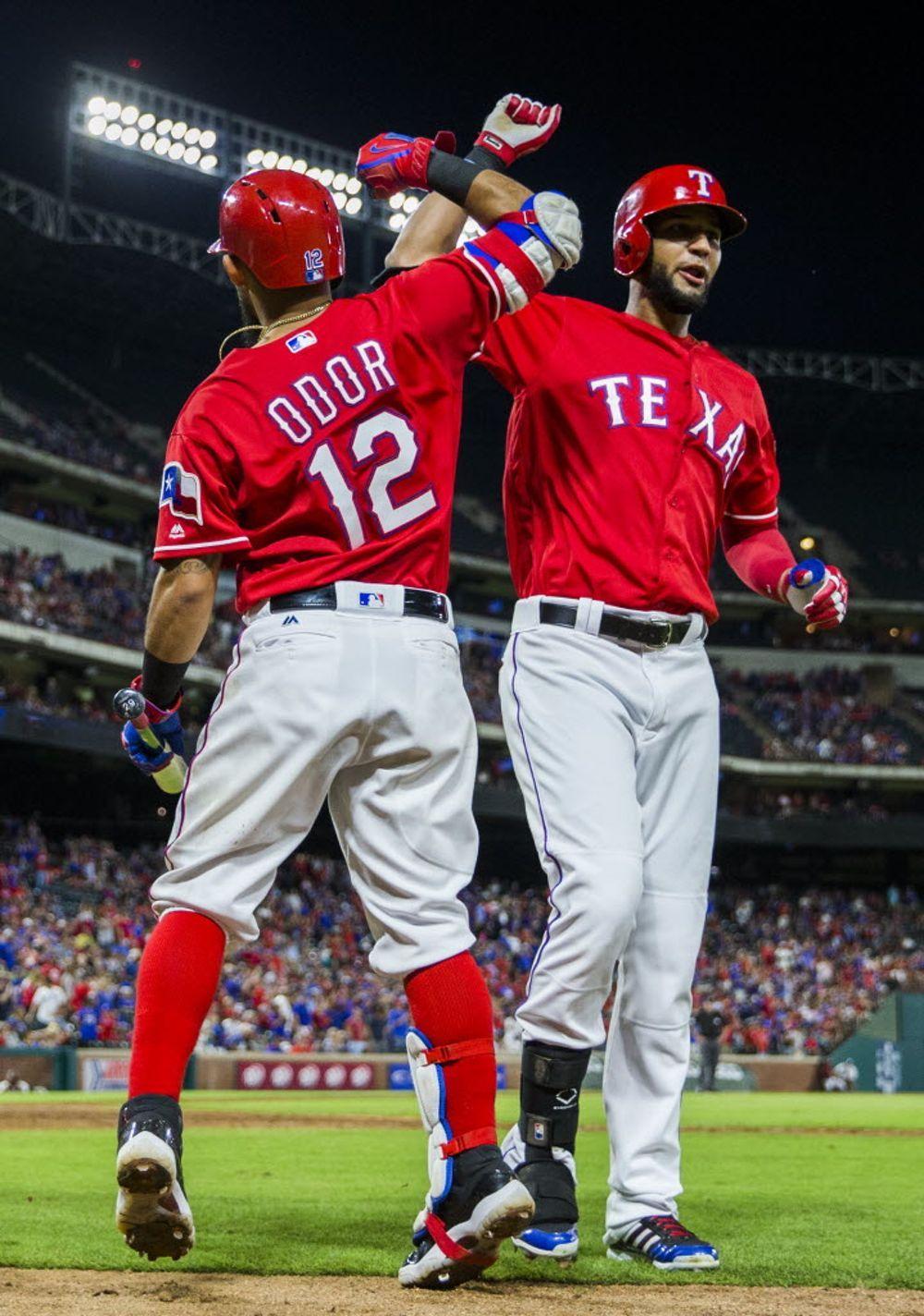 Texas Rangers Second Baseman Rougned Odor (12) High Fives Right