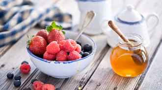 Bowl Of Berries With Honey 