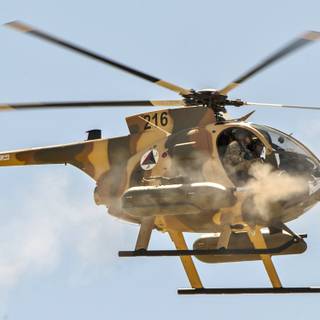 Helicopter firing rockets wallpaper