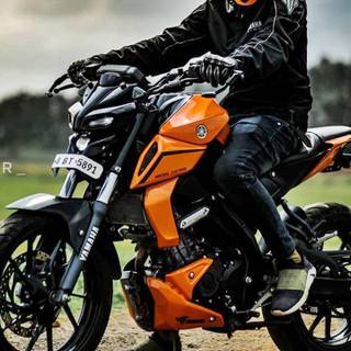 Modified orange Yamaha MT15 wallpaper