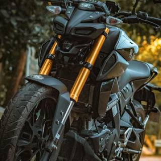 Modified orange Yamaha MT15 wallpaper