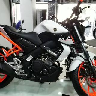 Modified orange Yamaha MT15 wallpaper