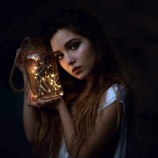 Women holding lantern wallpaper