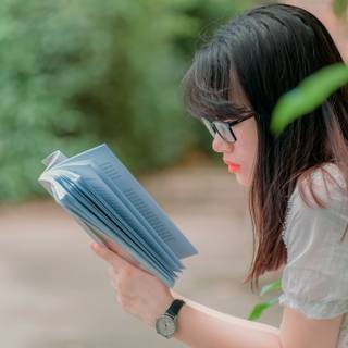 Girl with book wallpaper