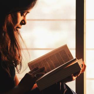 Girl with book wallpaper