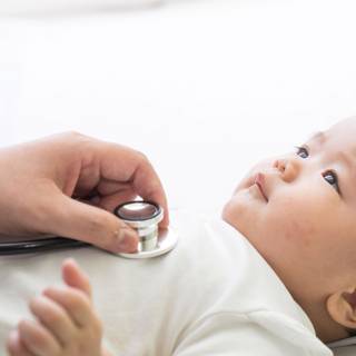 Baby with stethoscope wallpaper