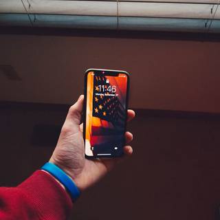 Holding phone wallpaper