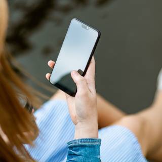 Holding phone wallpaper