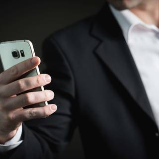 Holding phone wallpaper