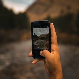 Holding phone wallpaper