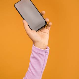 Holding phone wallpaper