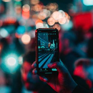 Holding phone wallpaper