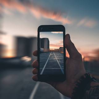 Holding phone wallpaper