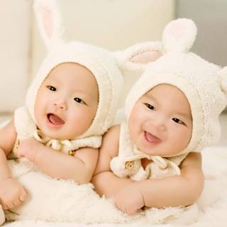 Cute white twins wallpaper