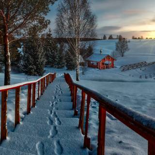 Snow covered cabin wallpaper