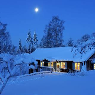Snow covered cabin wallpaper