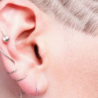 Ear piercing wallpaper
