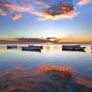 Boats at sunset wallpaper