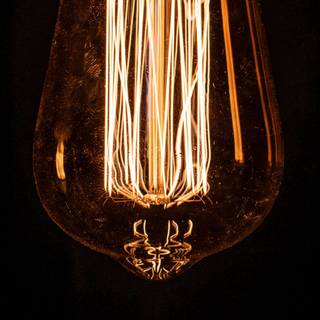 Light bulb glowing Ultra HD wallpaper