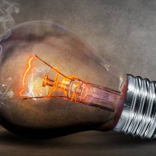 Light bulb glowing Ultra HD wallpaper