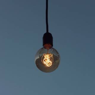 Light bulb glowing Ultra HD wallpaper
