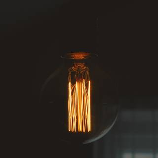 Light bulb glowing Ultra HD wallpaper
