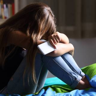 Sitting on bed wallpaper